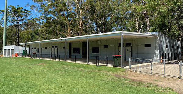 amenities building with turfed area in front