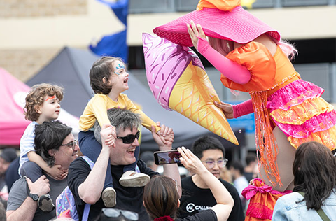happy girl on dads shoulders